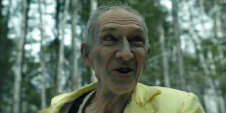 the-man-in-yellow-smiling-in-the-forest-in-from-season-3-finale